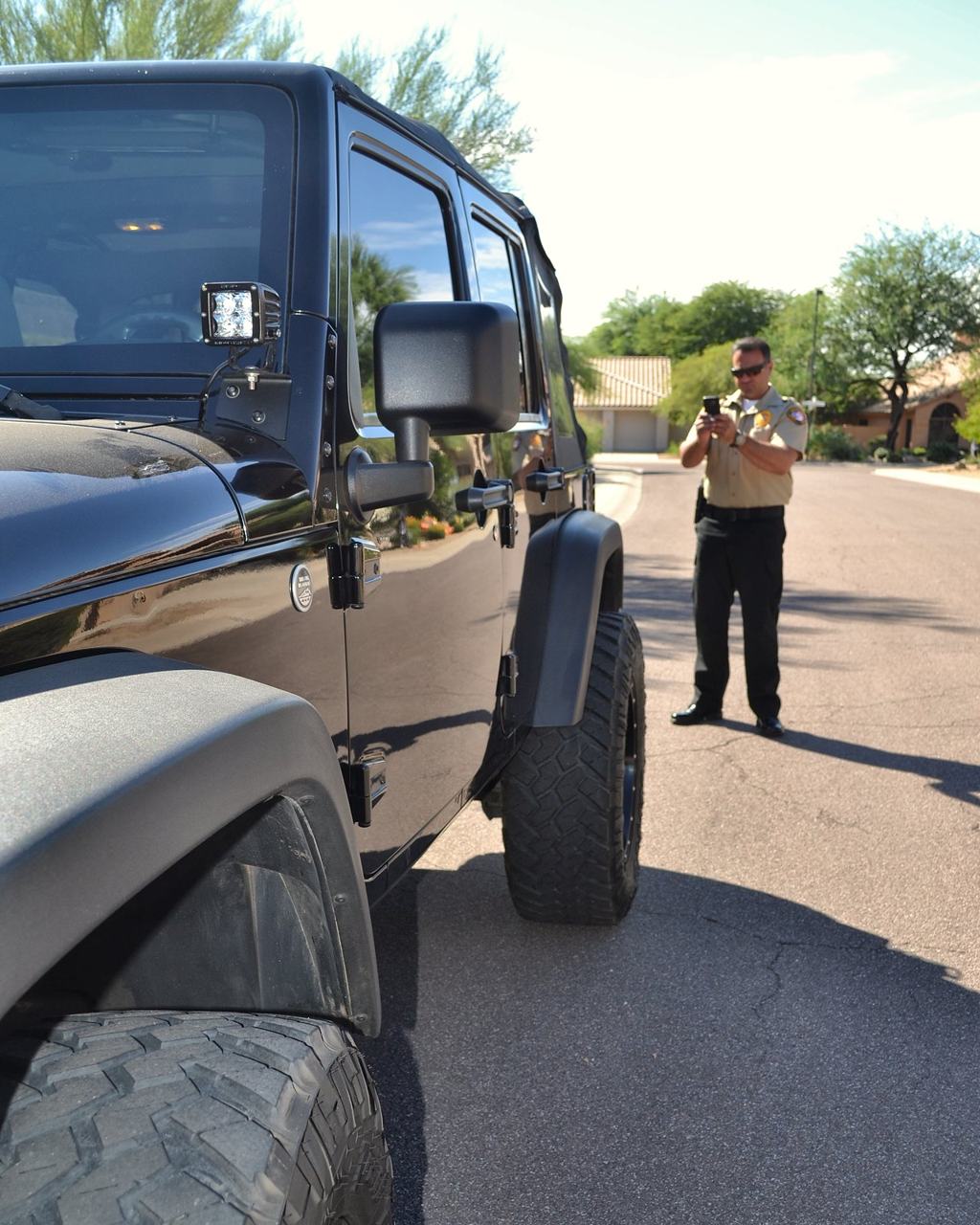 SecureOne security officer checking a parked vehicle